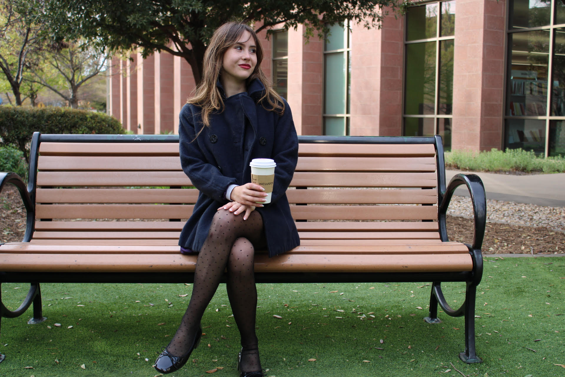 Cora Howell seated outdoors